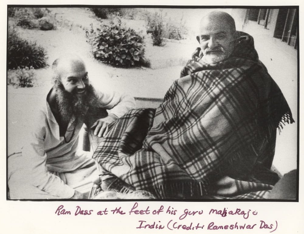 Neeb Karori Baba seated calmly with Ram Dass in India