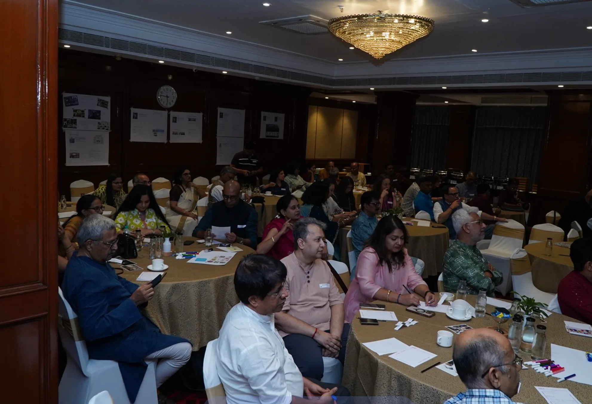 Participants seated around discussion tables at the ICF Bengaluru gathering
